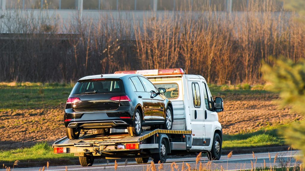 Car Recovery Vehicle Taking Small Car