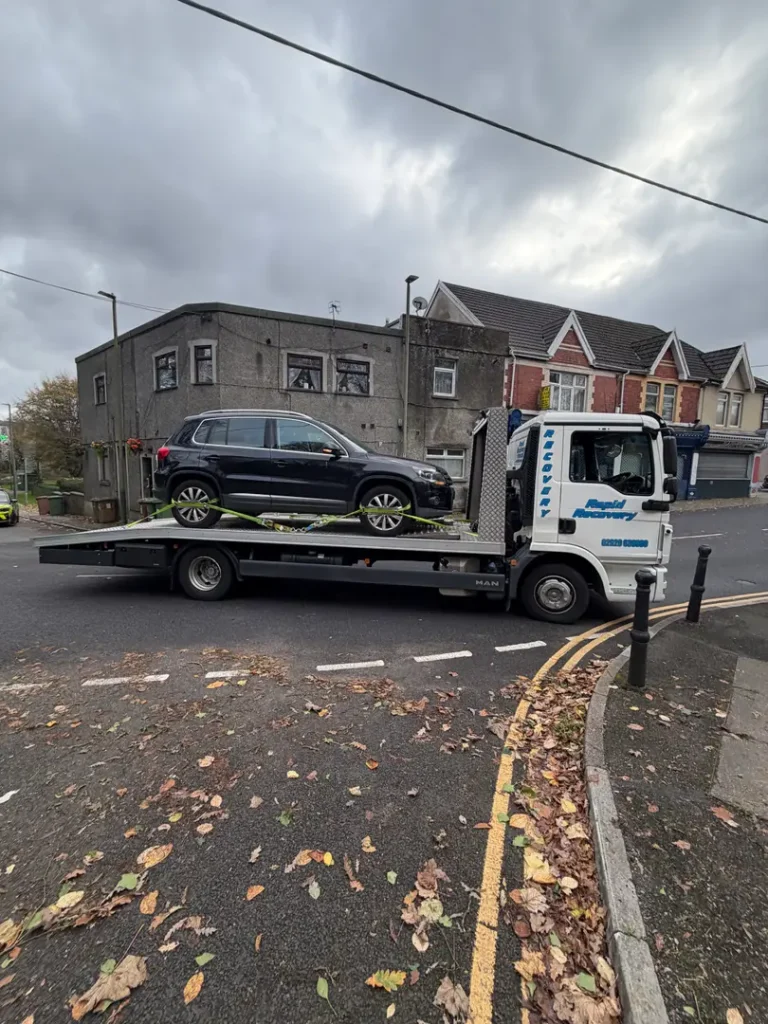 a car on a flatbed truck